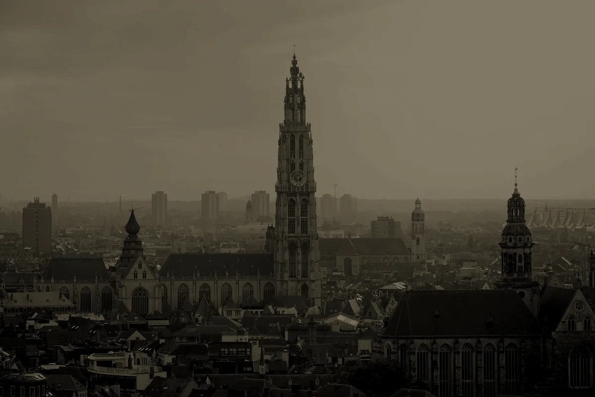 The tower of the Cathedral of Our Lady rising over the rooftops of Antwerp
