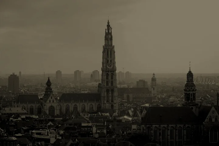 The tower of the Cathedral of Our Lady rising over the rooftops of Antwerp